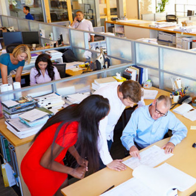 Office workers discussing Business Health Insurance in White Plains, Lake Success, NY, Melville, NY, and Nearby Cities